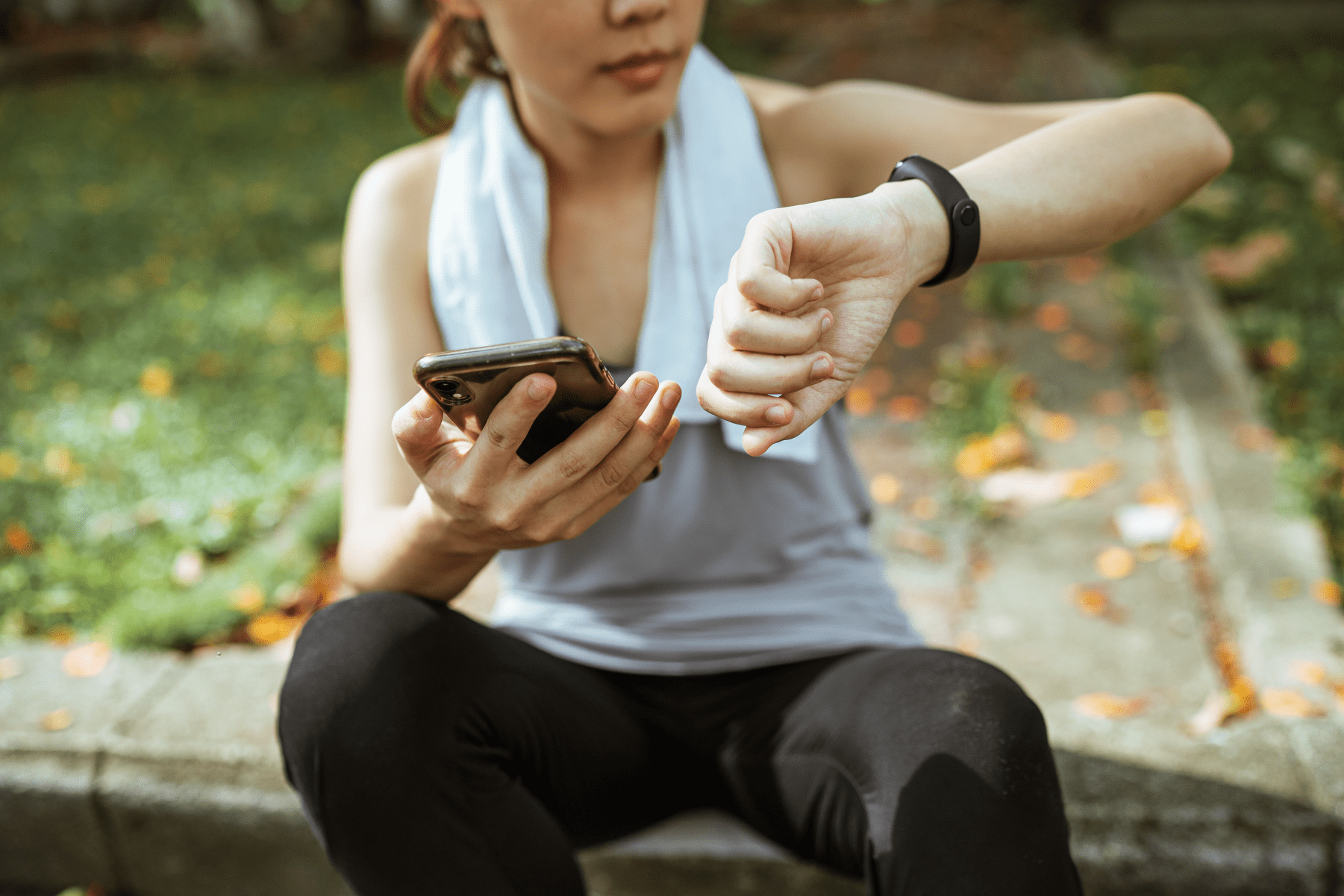 Woman holding phone after a workout