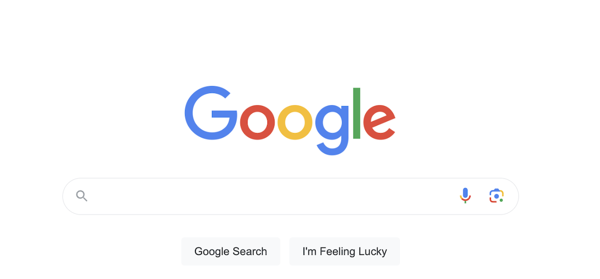 Google search homepage: White background with colorful Google logo above a rectangular search bar. 'Google Search' and 'I'm Feeling Lucky' buttons below.